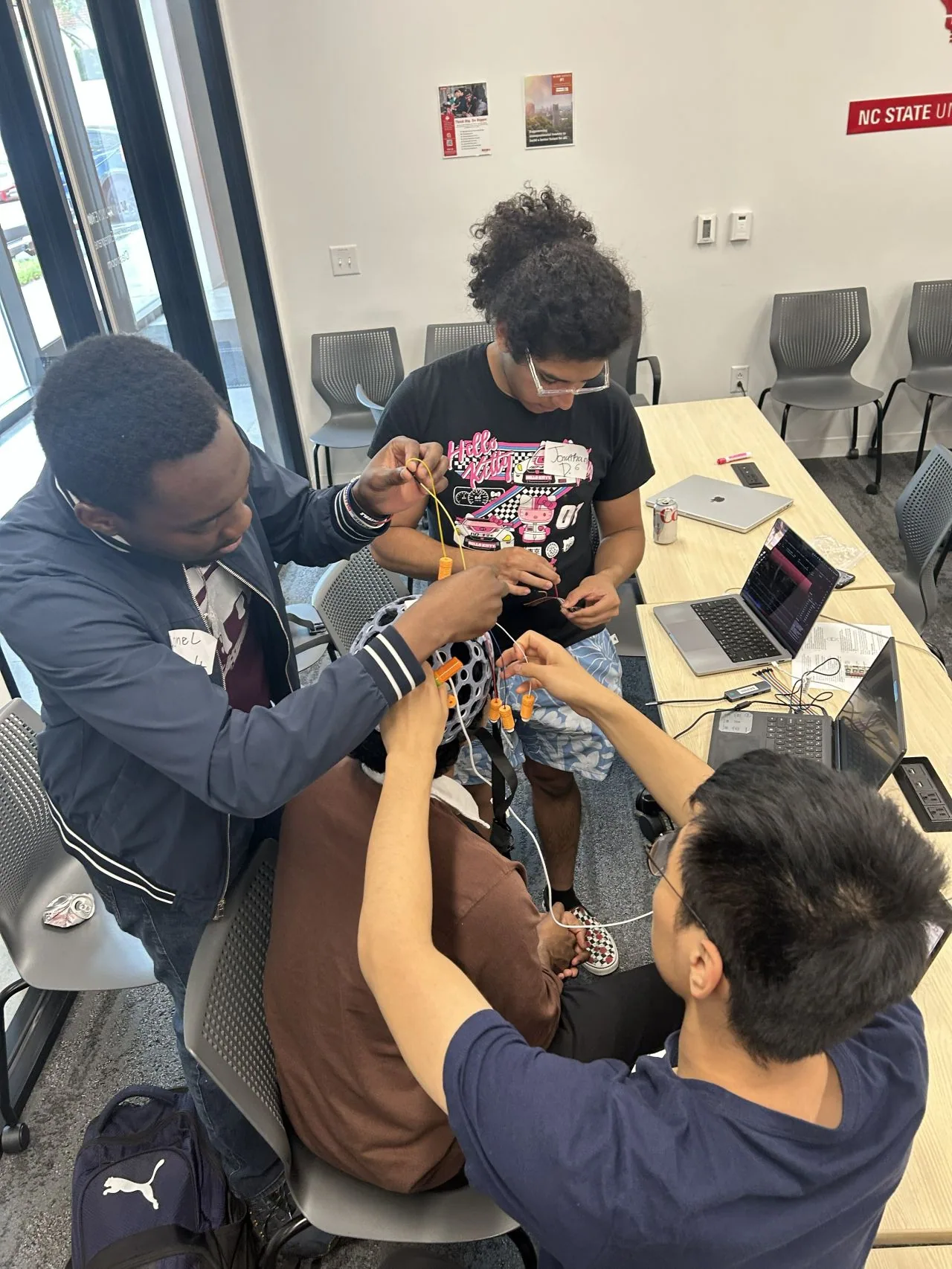 Students prototyping BCI projects at the BR41N.IO Hackathon